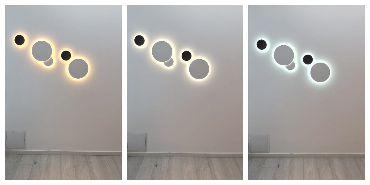 LedS.fi verkkokaupasta löytyy useita sarjan LED-seinävalaisimen muodostaen pyöreitä design-elementtejä eri kokoisina, täydellinenna valkoiseen seinään. Jokainen valaisin luon valaistustunnelman: lämpimän keltaisen, pehmeän valkoisen ja viilemmän sinertävän hehkun. Ympäröivä seinä ja lattia ovat sävyltään harmaita.